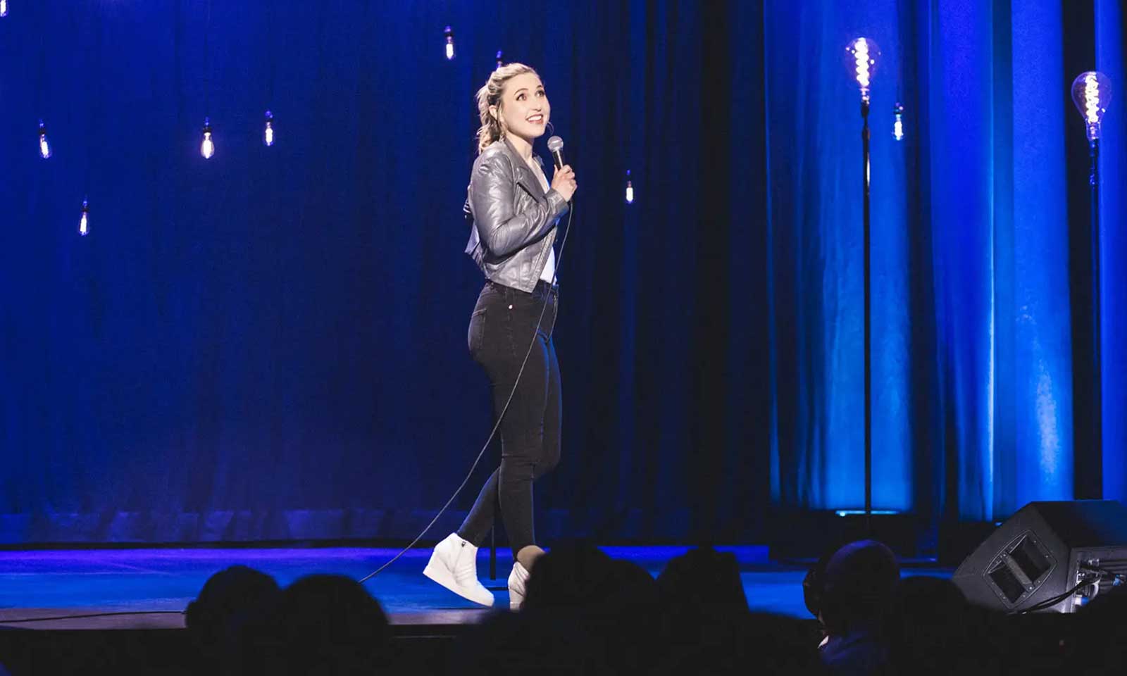 Taylor Tomlinson performing on tour
